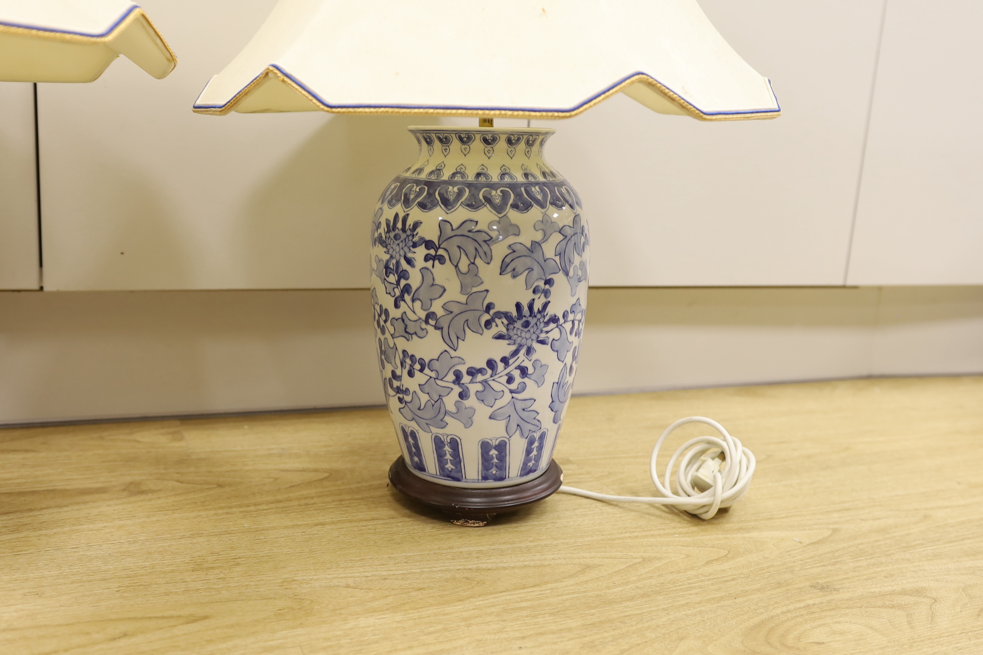 A pair of Chinese blue and white vases, converted to table lamps, overall 69cm high